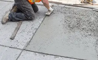 Professional repairing a concrete floor in New Orleans, LA
