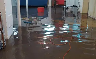 Basement with boiler, cabinets and washing machine completely flooded in New Orleans, LA